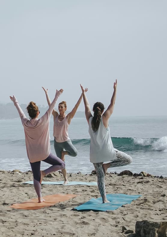 Women practising yoga at a beachfront retreat in Costa Rica